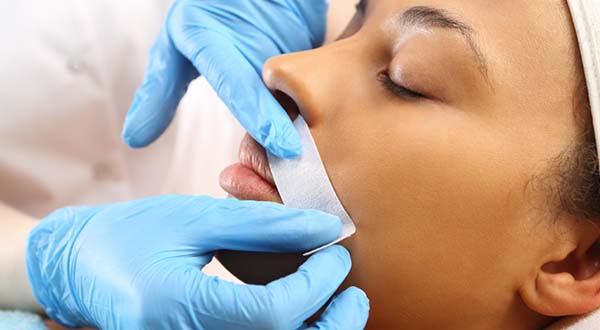 woman getting upper lip waxed