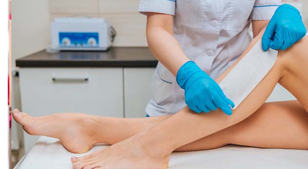 person having leg and body waxed